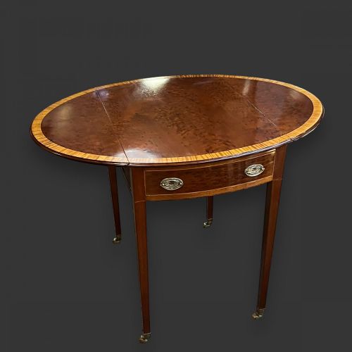 An Edwardian Period Mahogany Oval Pembroke Table