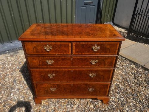 A George II Style Burr Walnut Chest Of Drawers View II