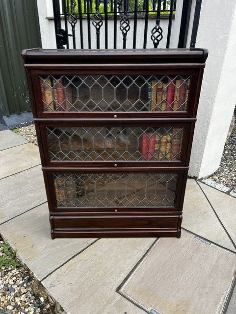 A SOLID MAHOGANY THREE TIER GLOBE WERNICKE STACKING BOOKCASE