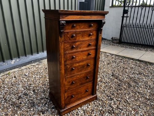 A VICTORIAN PERIOD WALNUT SECRETAIRE WELLINGTON CHEST