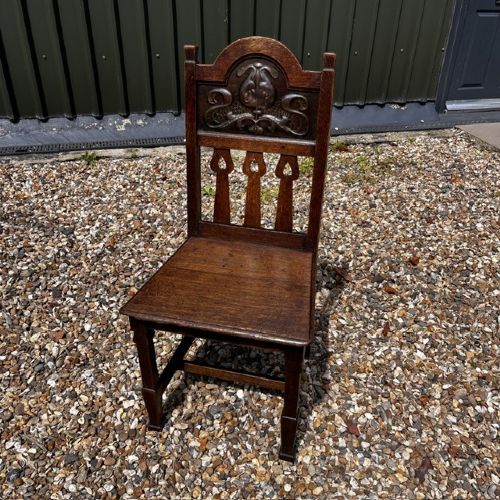A RARE OAK HALL CHAIR MADE BY SHAPLAND PETTER OF BARNSTAPLE