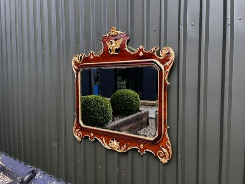 A Chippendale style horizontal wall mirror featuring a polished mahogany frame adorned with carved giltwood scrollwork and a central gilt eagle crest. View VII