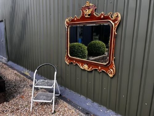 A Chippendale style horizontal wall mirror featuring a polished mahogany frame adorned with carved giltwood scrollwork and a central gilt eagle crest. View VIII