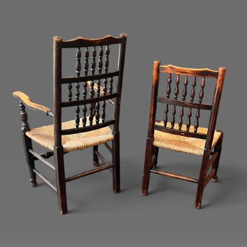 A set of ten dark oak Victorian Lancashire dining chairs with tiered spindle backrests and hand-woven rush seats. View V