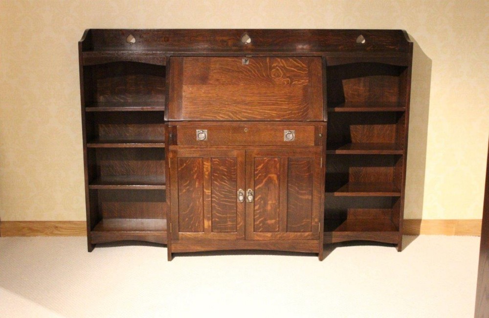 An Oak Arts & Crafts Period Bureau/Open Bookcase By Liberty's Of London
