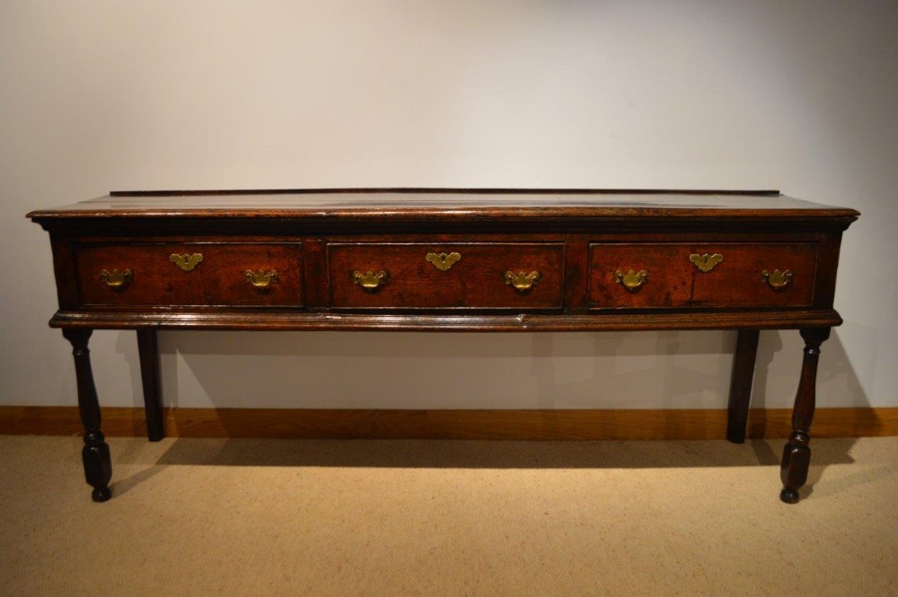 An Oak Georgian Period Three Drawer Dresser Base