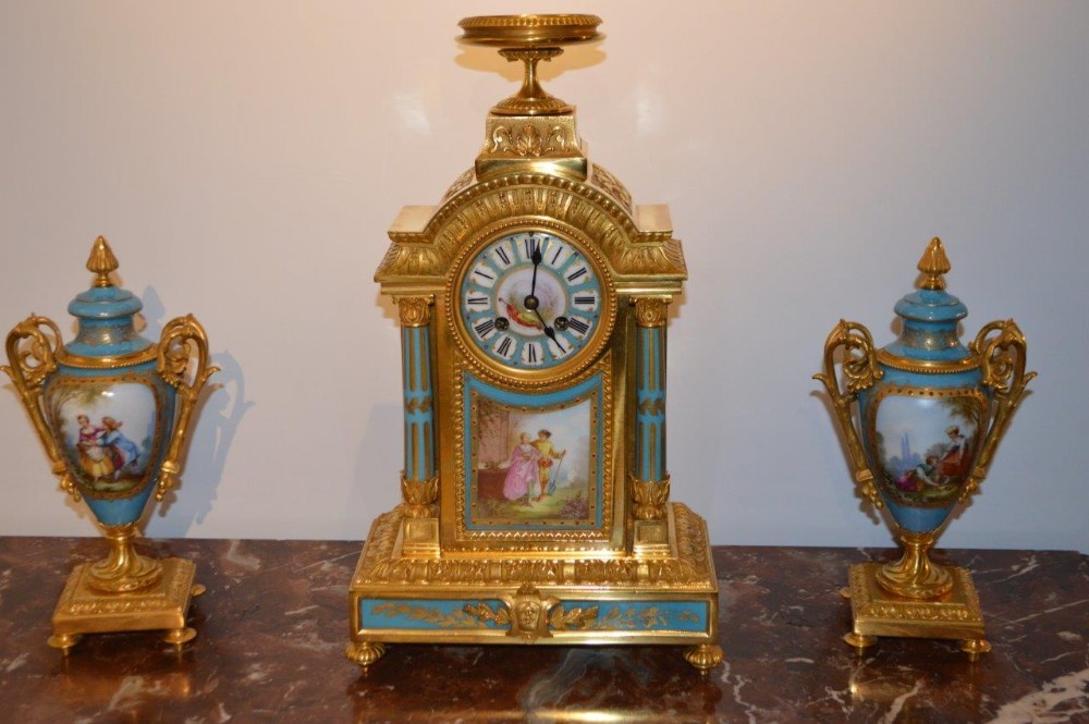 A French 19th Century Gilt Bronze & Sevres Clock Garniture
