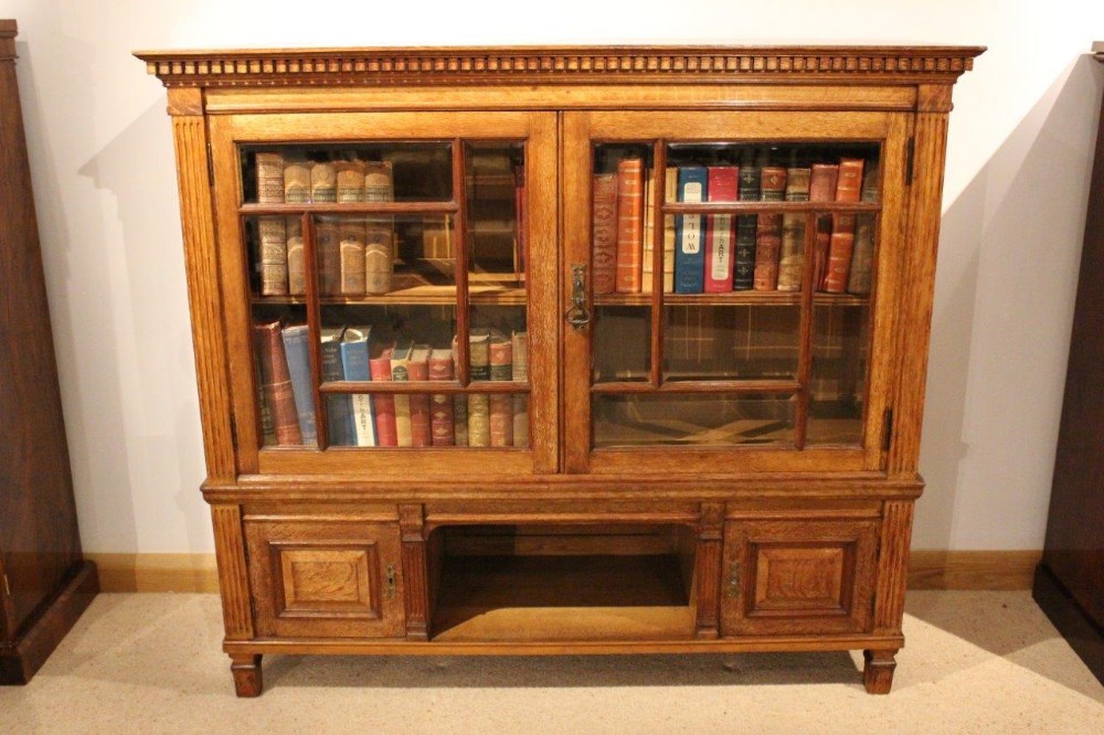 An Oak Late Victorian Period Antique Bookcase By Maple & Co