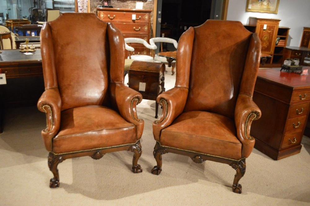 A Stunning & Rare Pair of Leather George II Style Wing Armchairs