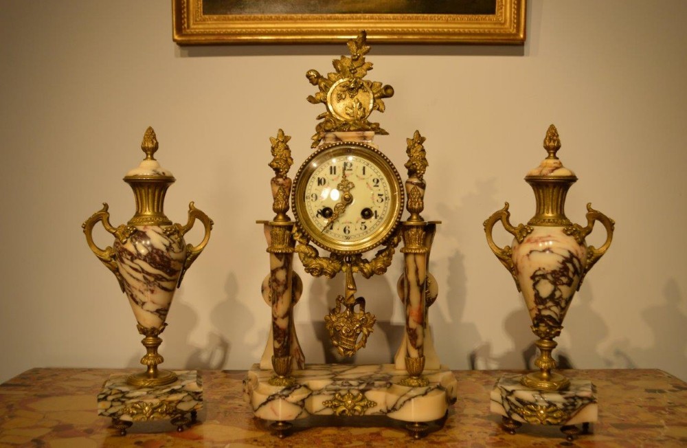 A French Late 19th Century White Veined Marble & Ormolu Clock Garniture