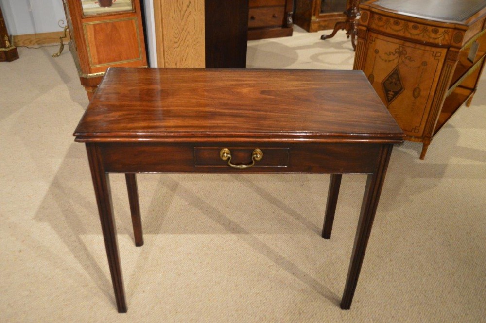 A Cuban Mahogany George II Period Fold Over Tea Table