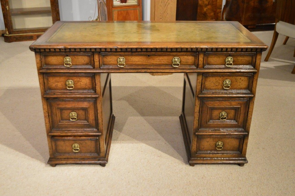 A Jacobean Revival Distressed Solid Oak Knee Hole Desk