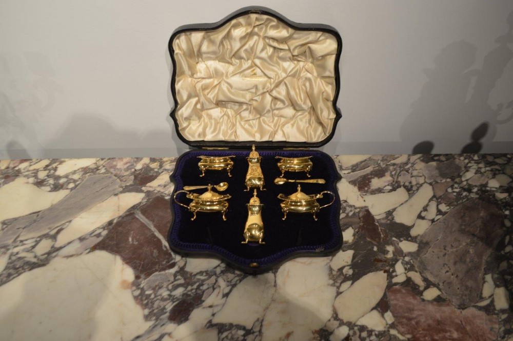A Silver Gilt Edwardian Period Six Piece Condiment Set