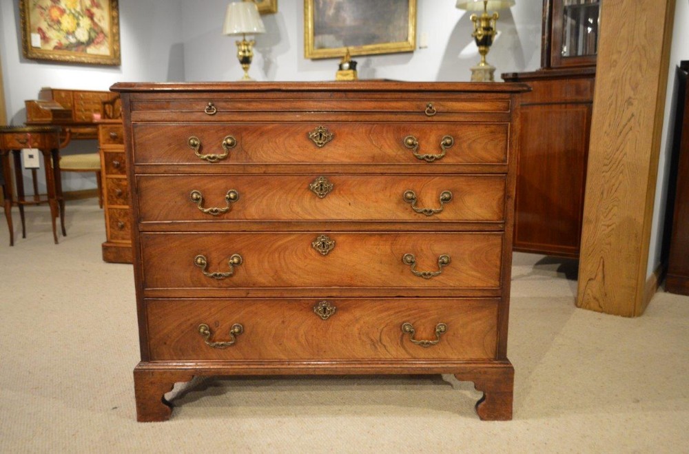 A Mahogany George III Period Antique Chest Of Drawers With Brushing Slide