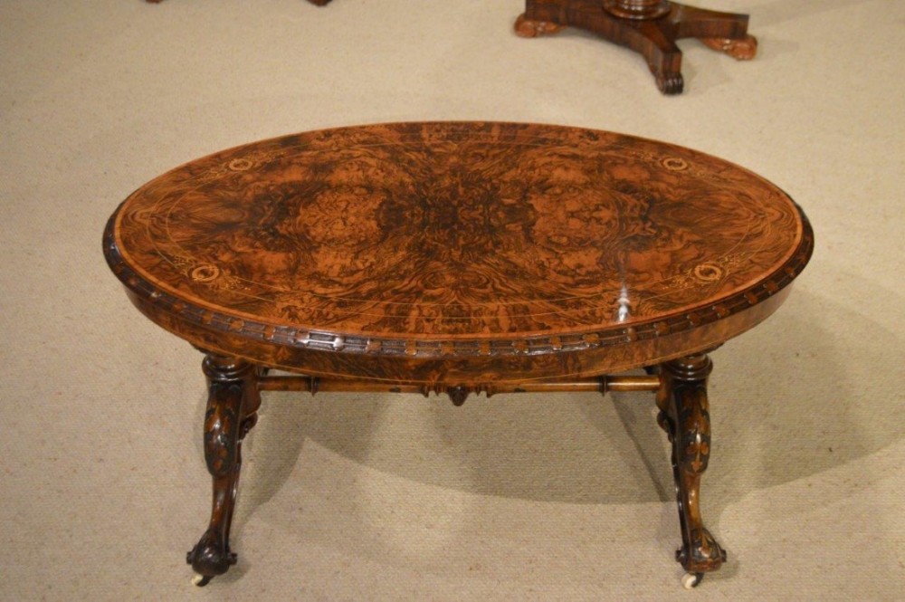 A burr walnut Victorian Period oval coffee table (adapted)