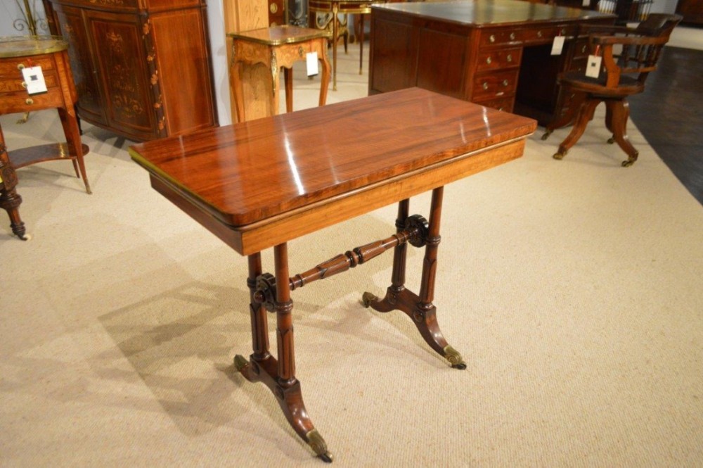 A Goncalo Alves Late Regency Period fold over card table.