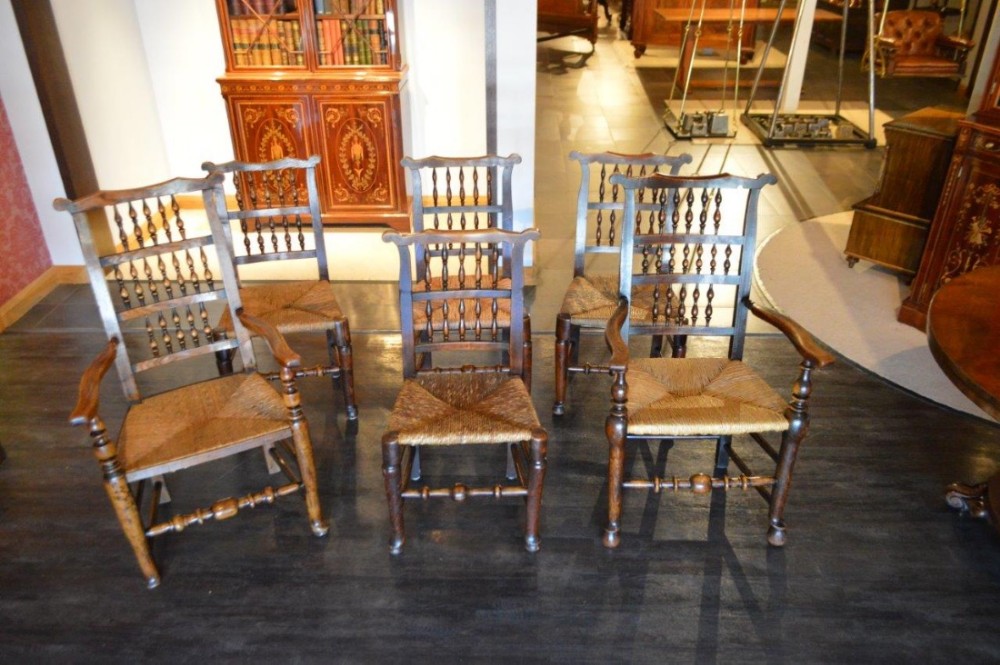 A Harlequin set of 6 ash and elm Lancashire spindle-back dining chairs including two carver armchairs.