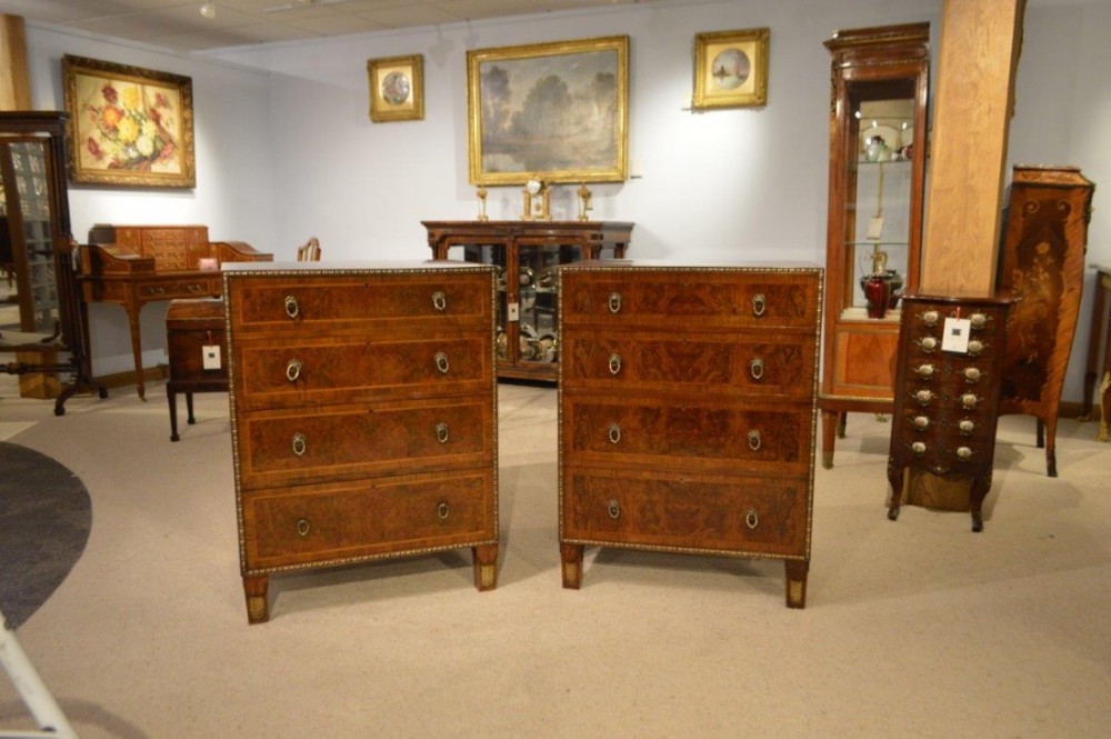 A rare pair of burr walnut & parcel gilt Art Deco Period chests.