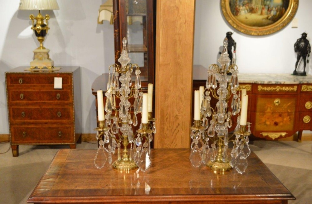 A pair of cut glass & brass Victorian Period candelabra.