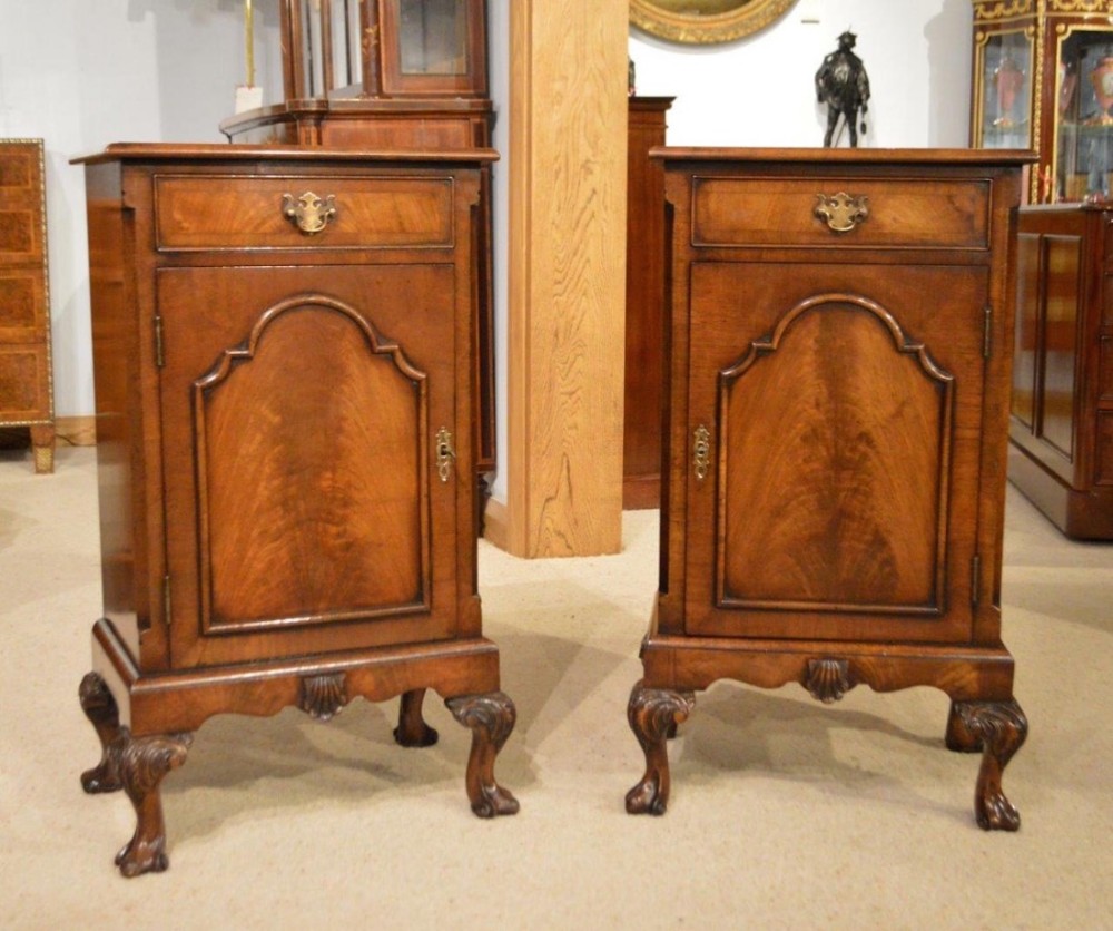 A pair of walnut 1920s Queen Anne Style antique bedside cabinets.