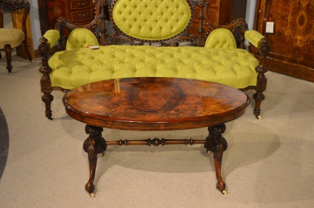A burr walnut & marquetry inlaid Victorian Period antique coffee table (adapted).