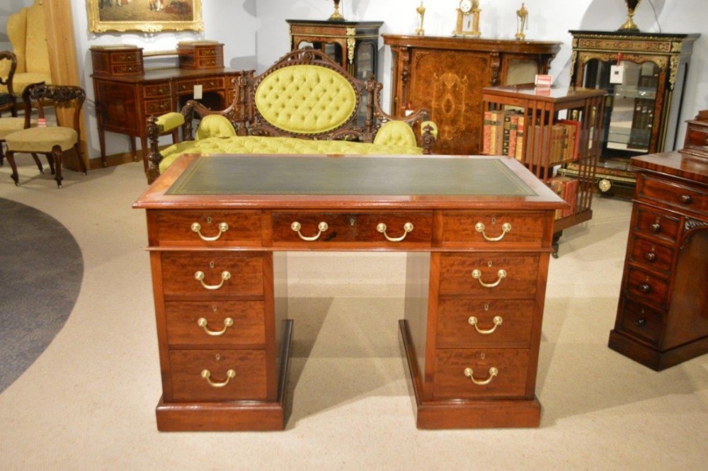 A mahogany Edwardian Period pedestal desk by James Shoolbred & Co