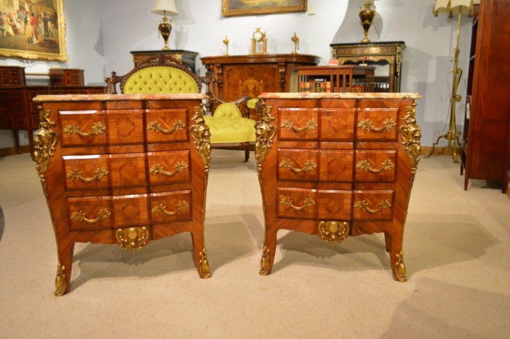 A good pair of rosewood French Louis XVI Style three drawer chests 