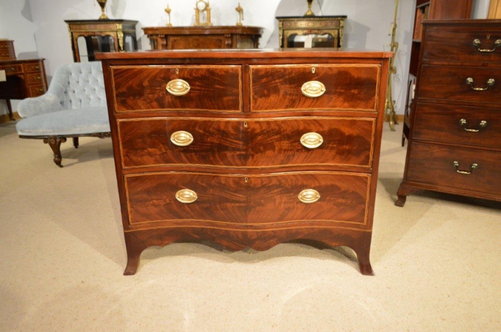A Beautiful Flame Mahogany Edwardian Period Serpentine Chest of drawers.