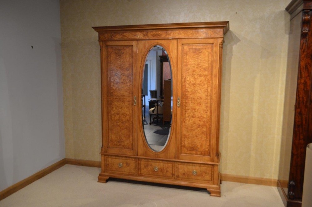 A fine quality satinwood and burr ash inlaid Edwardian Period wardrobe by Shapland & Petter of Barnstaple.