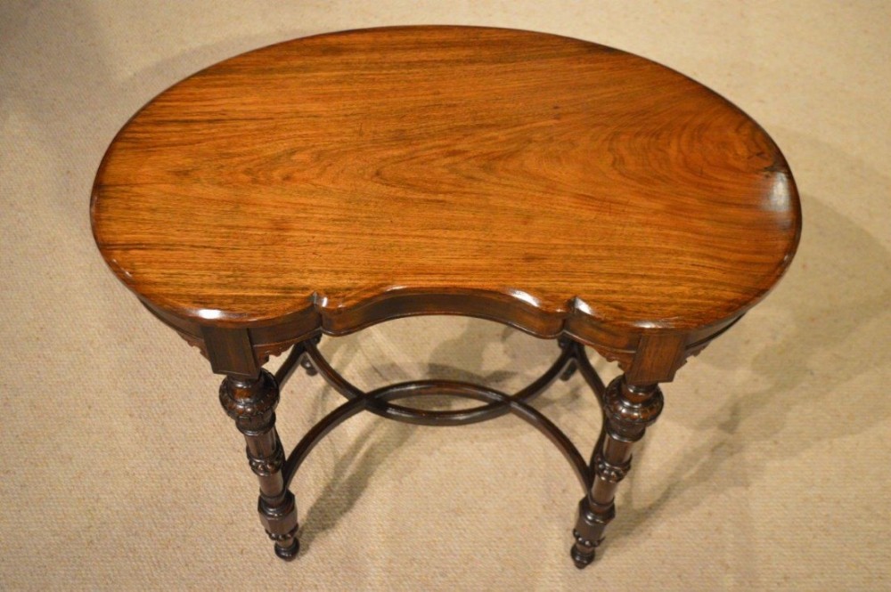 A solid rosewood Victorian Period kidney shaped occasional table. 