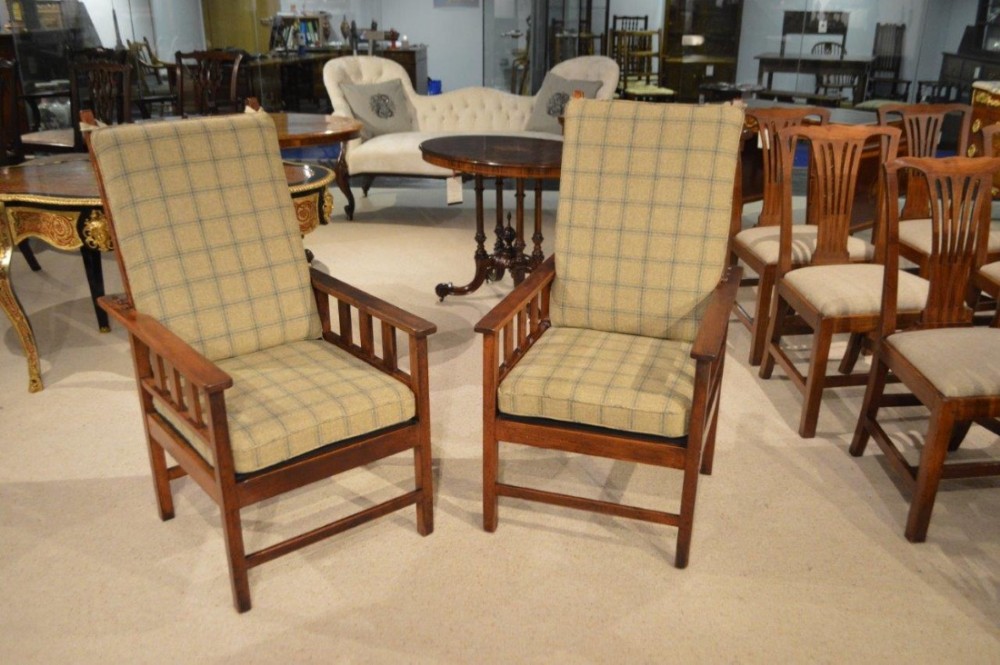 A pair of mahogany Arts & Crafts Period antique reclining chairs