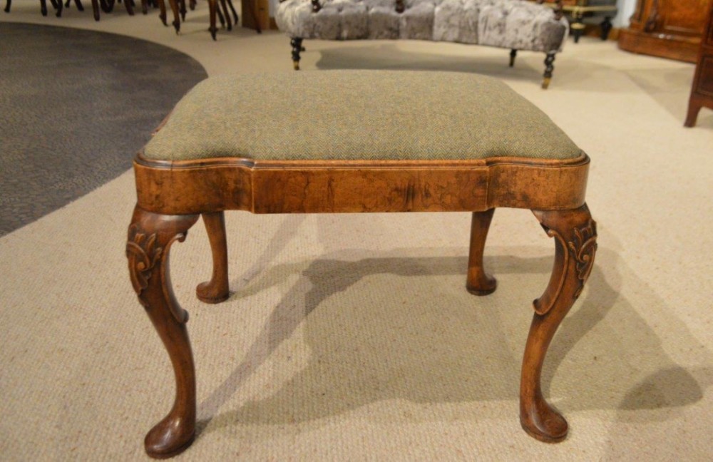 A walnut George I Style antique stool.