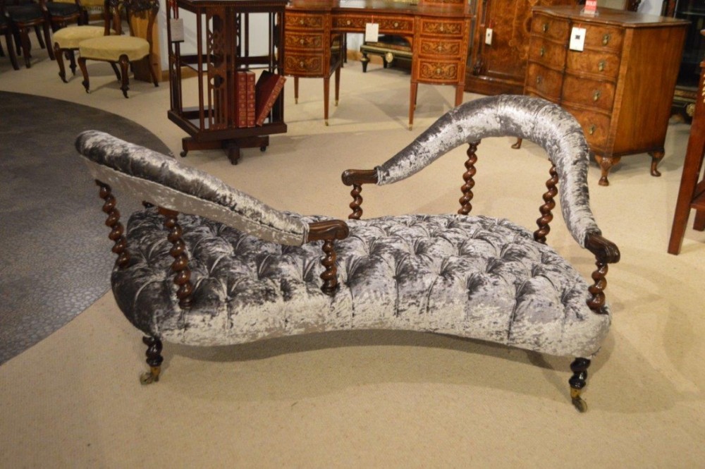 A beautiful rosewood Early Victorian Period conversation/love settee. 