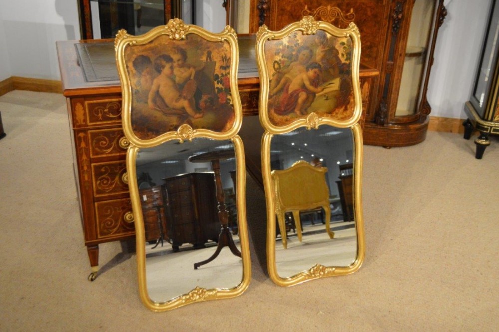 A fine pair of carved gilt wood and Vernis Martin pier mirrors