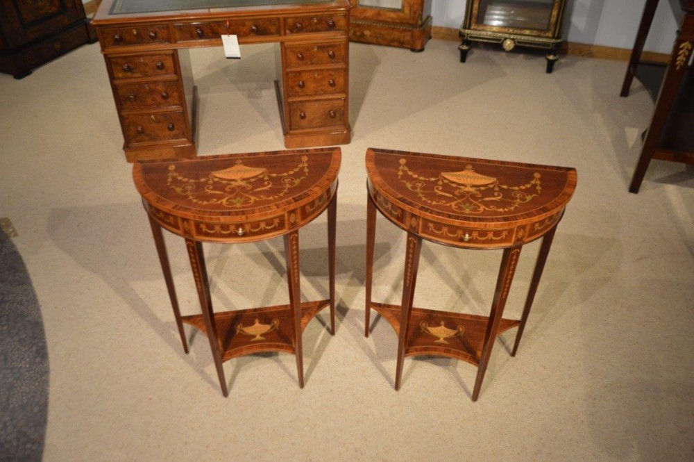 A superb & rare pair of mahogany inlaid Edwardian Period antique demi lune tables by Edwards & Roberts Of London.