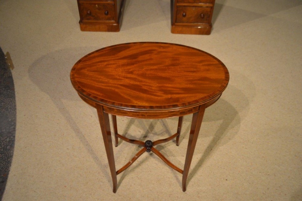 A small mahogany Edwardian Period oval inlaid occasional table.