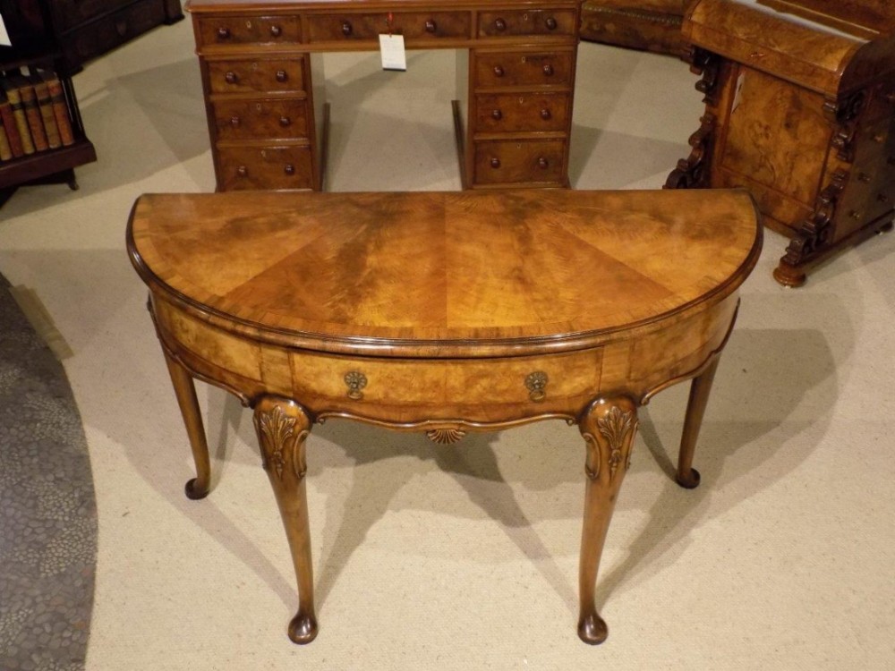 A beautiful walnut George I Style demi lune console table