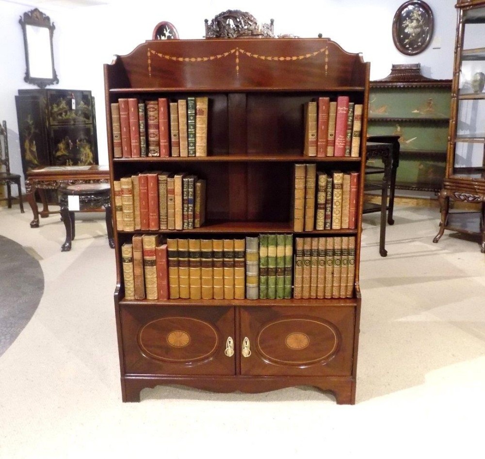 A Beautiful Mahogany inlaid Edwardian Period waterfall bookcase by Shapland & Petter of Barnstaple