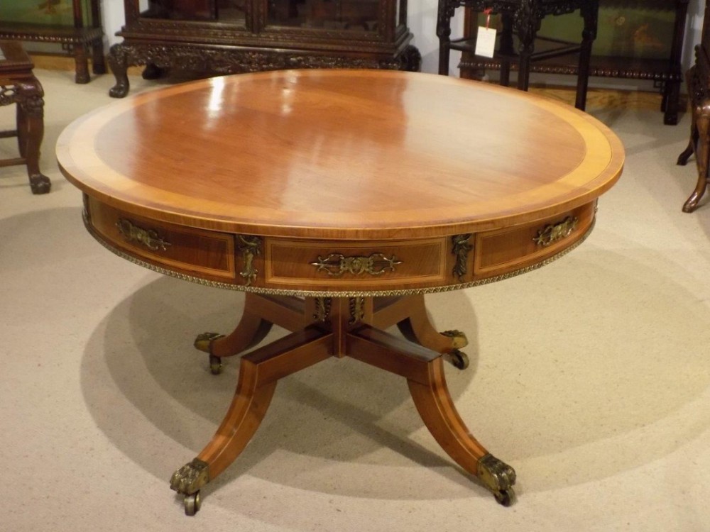A rosewood and satinwood Regency Period antique circular drum table