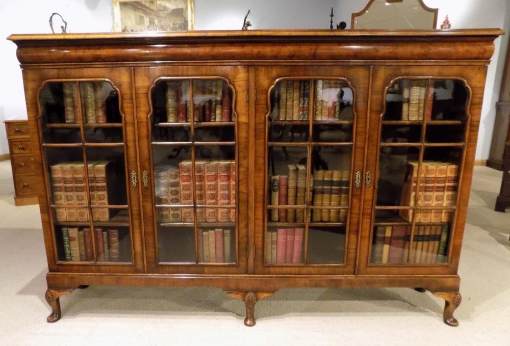 A Beautiful walnut Queen Anne Revival four door bookcase.