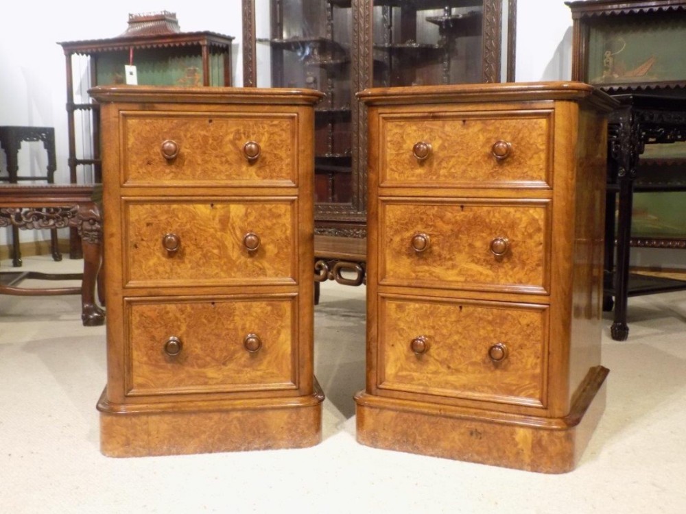 An exceptional pair of burr walnut Victorian Period antique bedside chests.