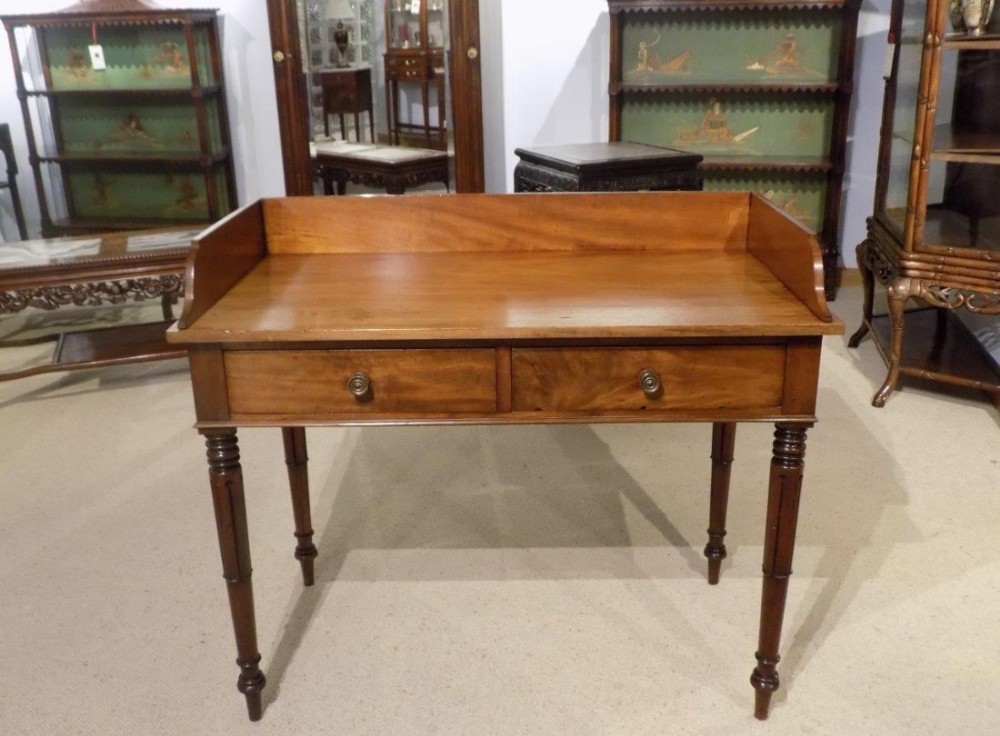 A mahogany William IV Period two drawer hall table
