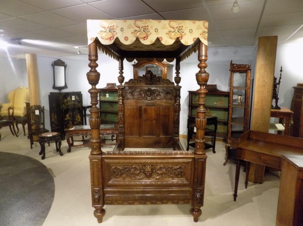 A Finely carved Italian baroque walnut four poster single bed