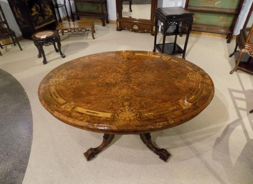 A beautiful burr walnut and marquetry inlaid Victorian Period antique loo table