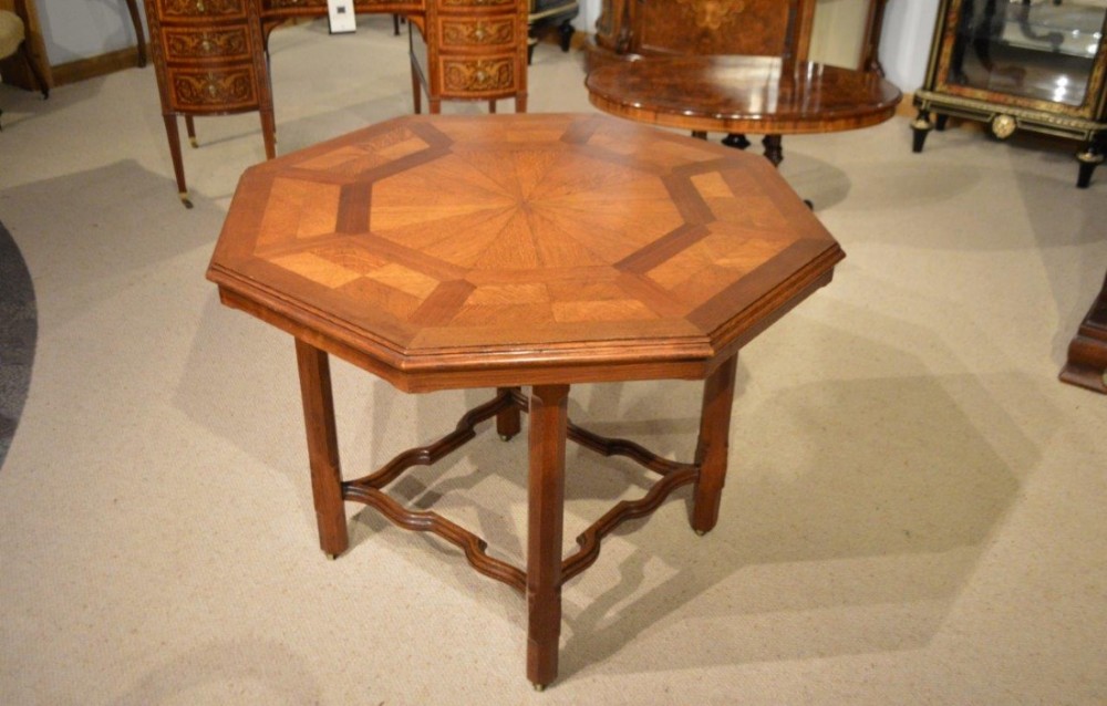 An oak Victorian Period octagonal parquetry table by Howard & Sons Of London.