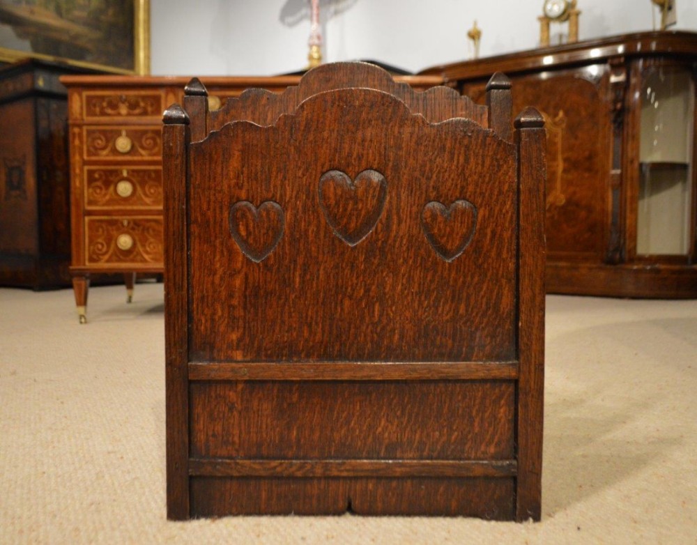 An Oak Arts & Crafts Period magazine rack possibly by Liberty's.