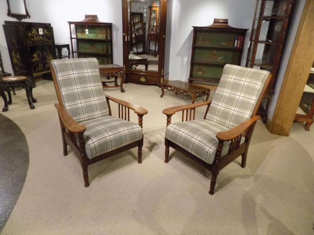 A good pair of oak Arts & Crafts Period reclining armchairs
