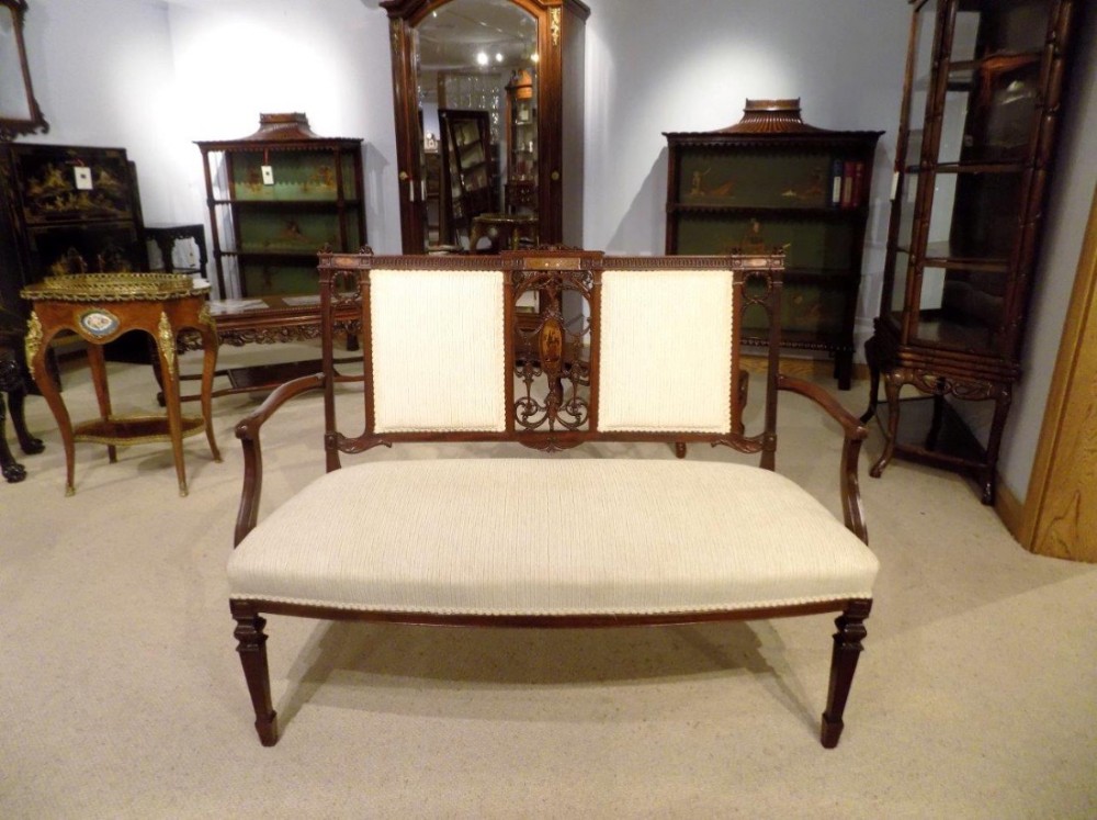 A fine quality mahogany inlaid and carved Edwardian Period Antique settee.