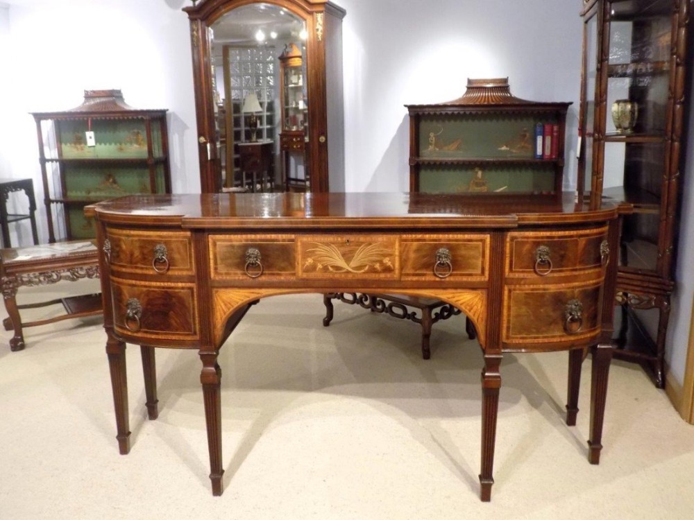 A fine quality mahogany inlaid Sheraton Revival sideboard.