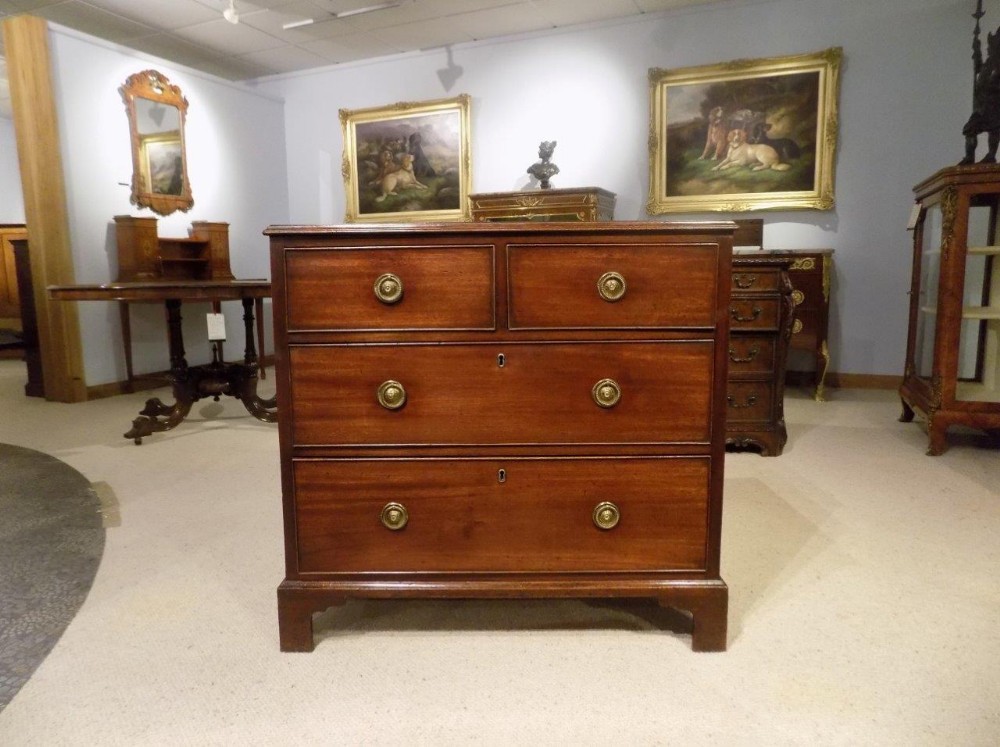 A small mahogany and oak Regency Period antique chest of drawers.